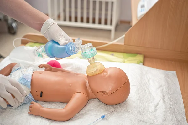 Newborn resuscitation on a mannequin