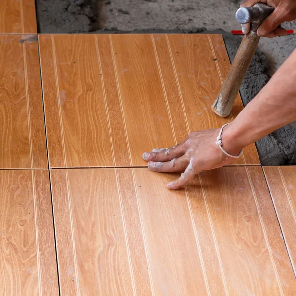 Floor tile installation for house building