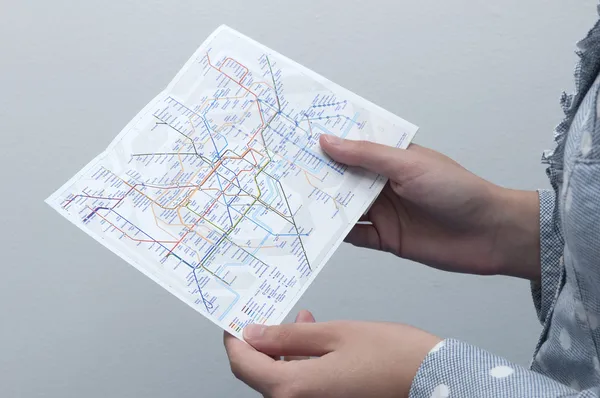 Woman looking to the Tube Map (London Underground)