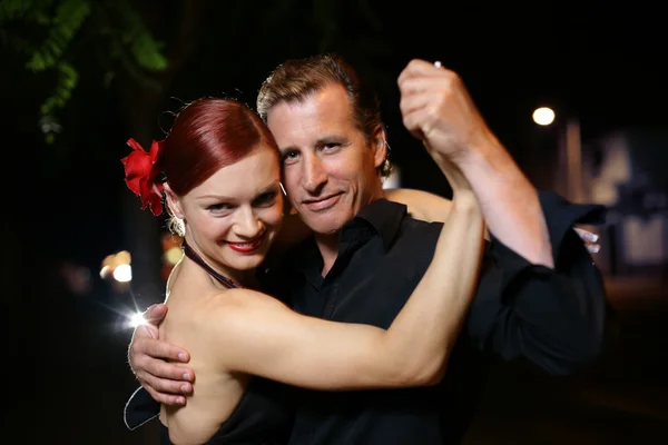 Young adult couple dancing tango