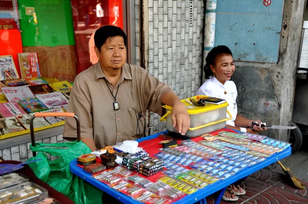 Bangkok, Thailand: Man and Woman Selling Lottery Tickets