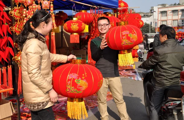 Pengzhou, China: Couple Selling Chinese New Year Decorations