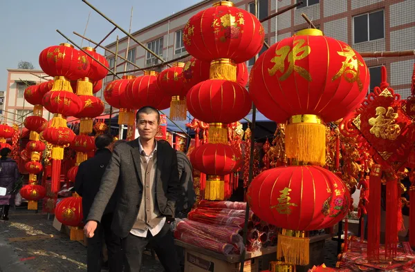 Pengzhou, China: Man Selling Chinese New Year Decorations
