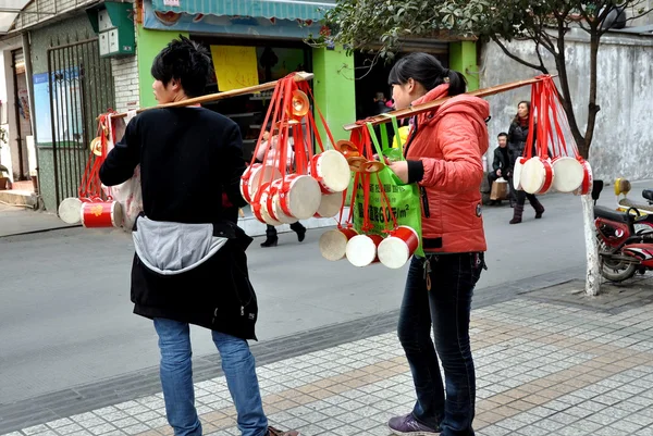 Pengzhou, China: Teens Selling Chinese New Year Drums
