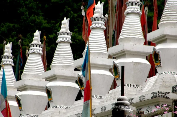 Jiuzhaigou, China: White Dagobas with Jing Fan Prayer Banners