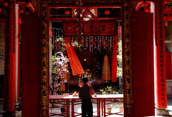 Georgetown, Malaysia: Man with Incenese Sticks at Chinese Temple