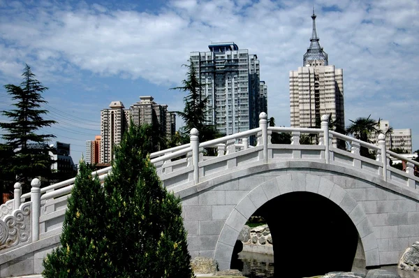 Xi'an, China: Chinese Bridge in Pagoda Park and City Skyline
