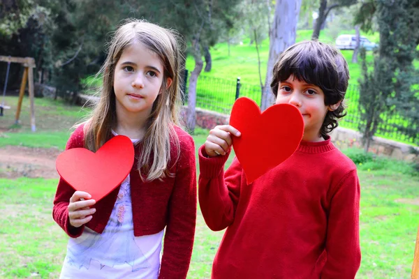 Valentine day red hearts two kids