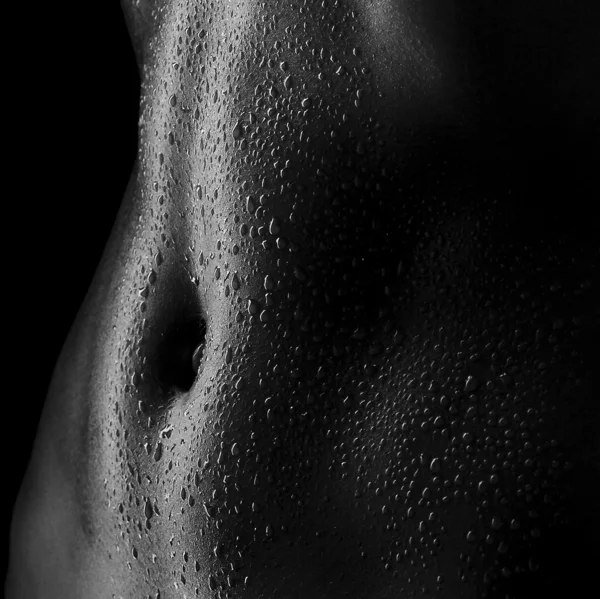 Sexy women's tummy in drops of sweat, ABS — Stock Photo #32974333