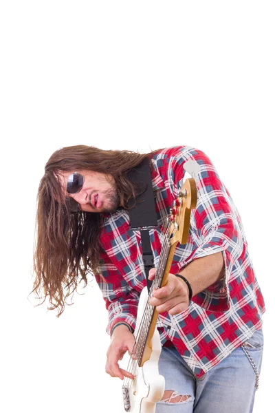 Male musician with face expression playing electric bass guitar