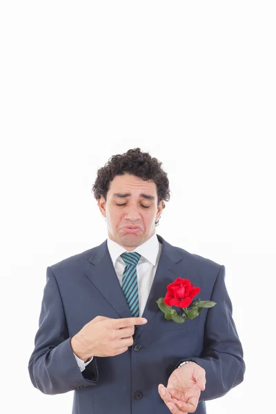 Disappointed man in suit with face expression showing with his h