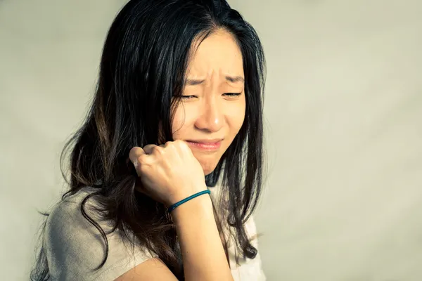 Woman crying and pulling hair