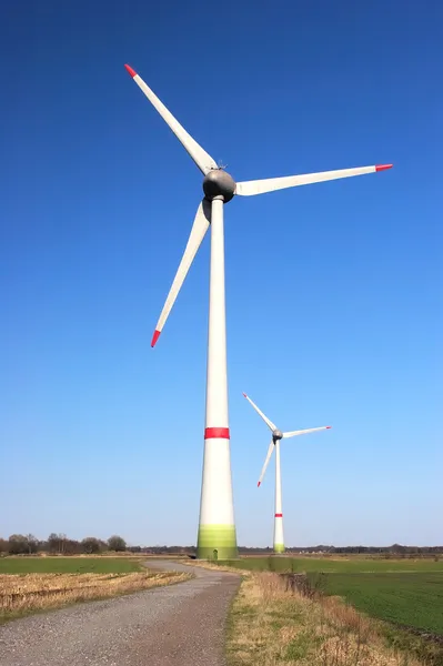 Two windmills on a cloudless sunny day