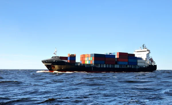 Cargo container ship sailing in the sea