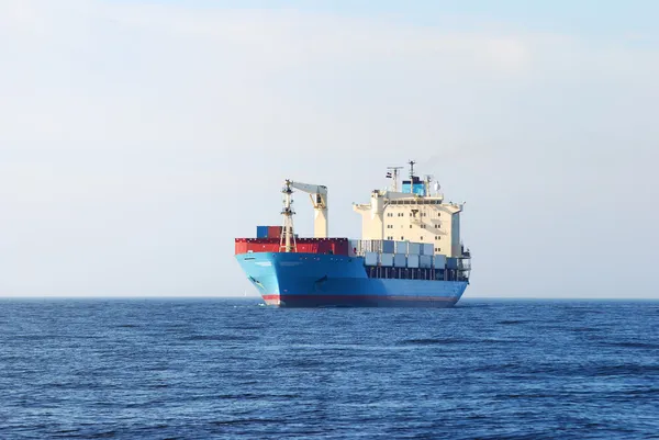 Cargo conteiner ship sailing in still water