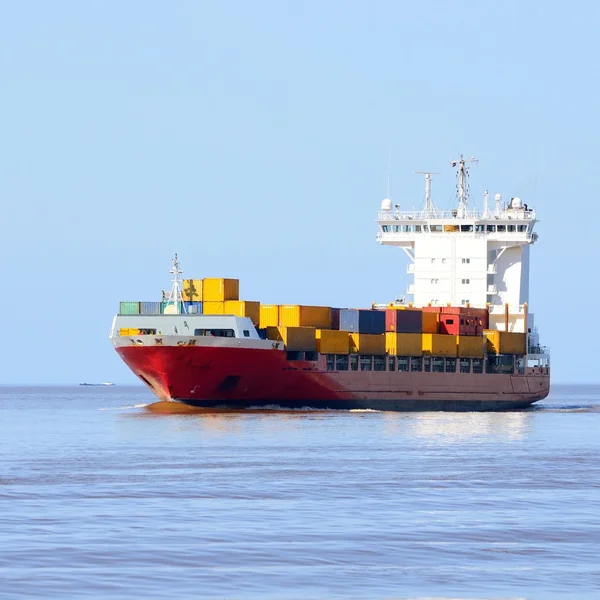 Colorful cargo container ship sailing