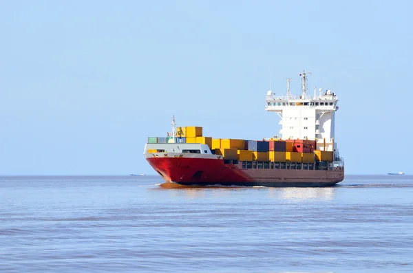 Colorful cargo container ship sailing