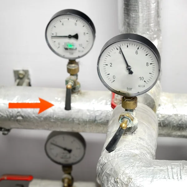 Thermometers on industrial water pipeline