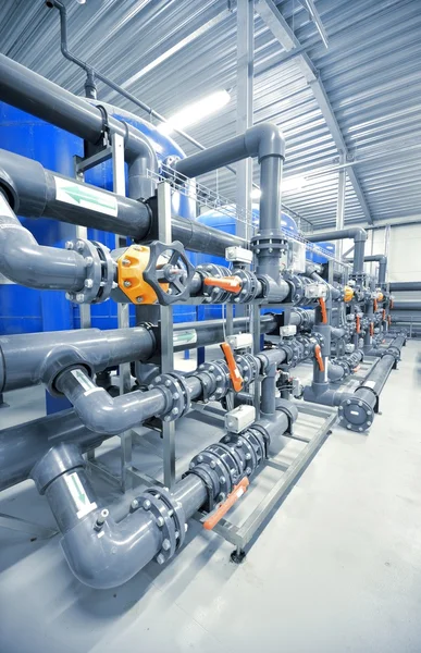New plastic pipes and colorful equipment in industrial boiler room