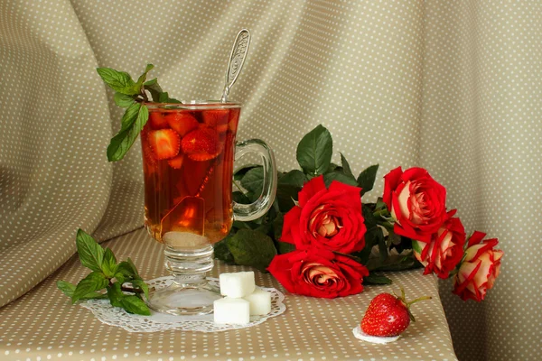 Strawberries, roses and a hot drink