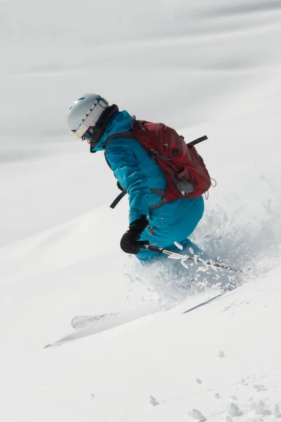 Close-up of female skier coming down off-piste