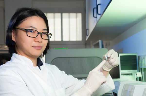 Chinese scientist with PCR tube