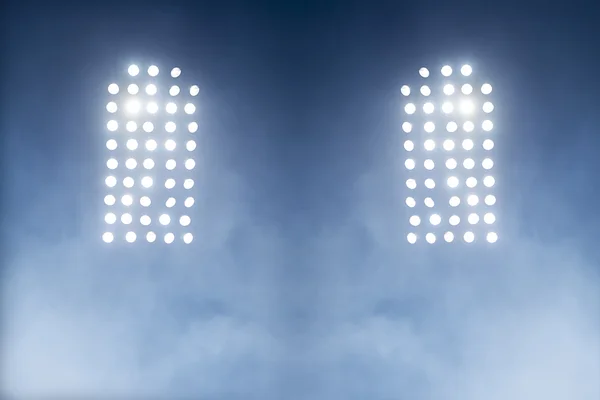 Stadium lights against dark night sky backgroundon