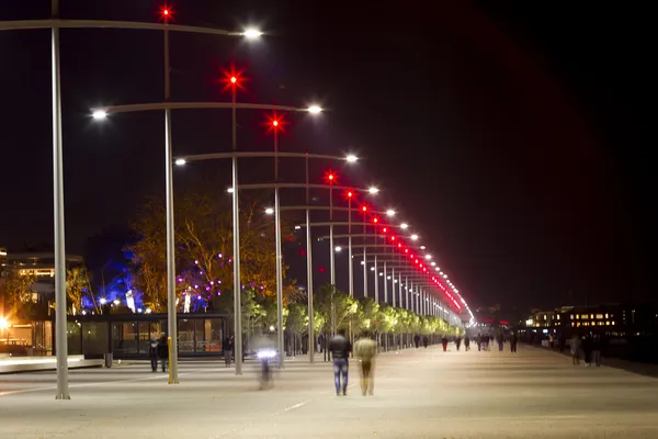 Lit street lights at night in Thessaloniki, Greece.