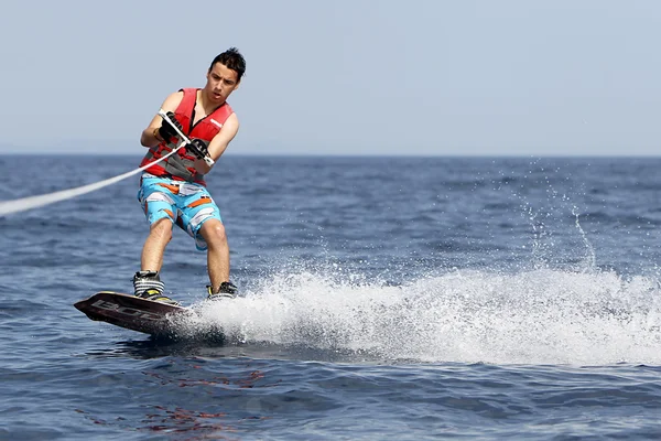 Unidentified man doing water ski on the sea in Kallithea, Greec