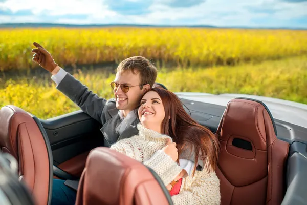 Happy couple in the car