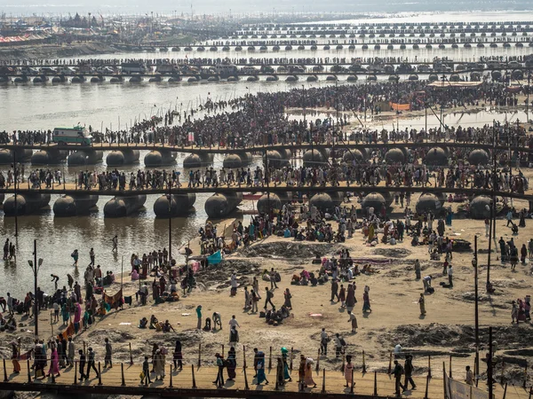 Hindu devotees crossing the pontoon bridges over the Ganges at Kumbh Mela 2013