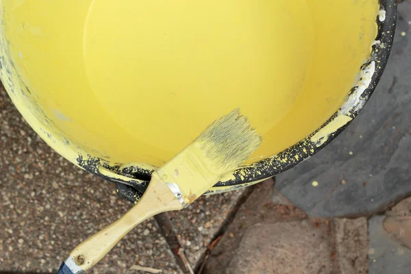 Paint brush with yellow paint