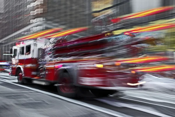 Fire trucks and firefighters brigade in the city