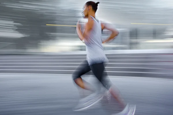 Athlete running on the city street