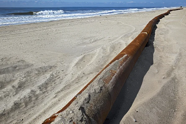 Rusty pipes along the sea beach