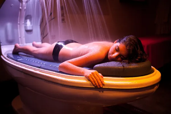 Lying and relaxed woman during spa treatment.
