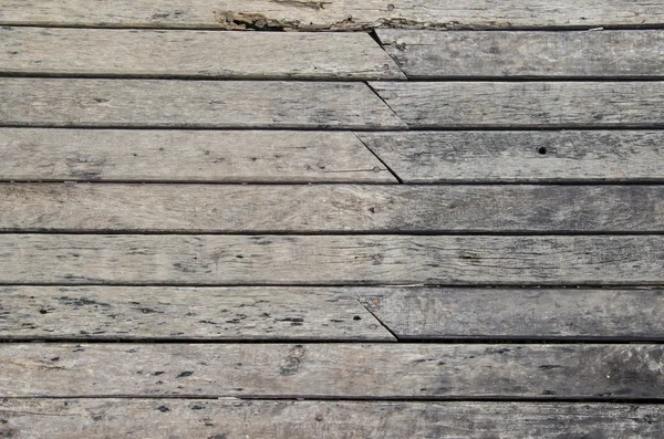 Rustic weathered barn wood background with knots and nail holes