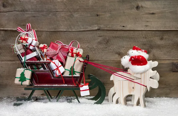 Christmas card decoration: elks pulling santa sleigh with presen