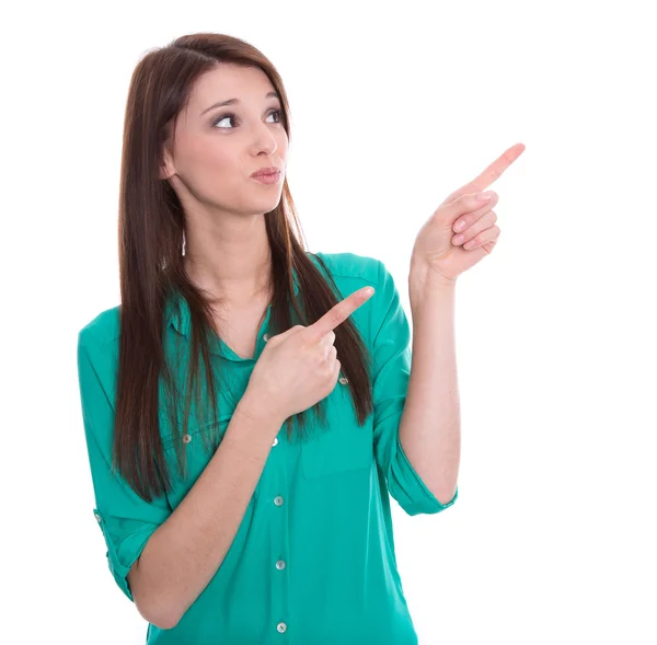 Isolated young funny woman is presenting or pointing with finger.