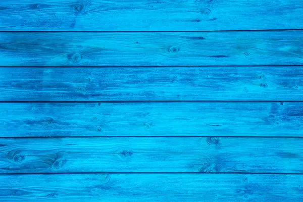 Surface of an empty blue wooden background.