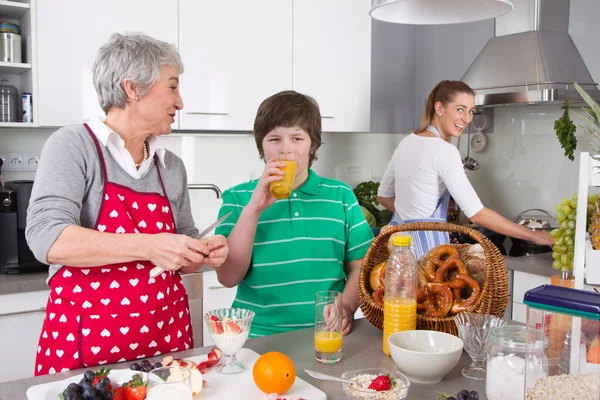 Three generations living together - happy family cooking togethe