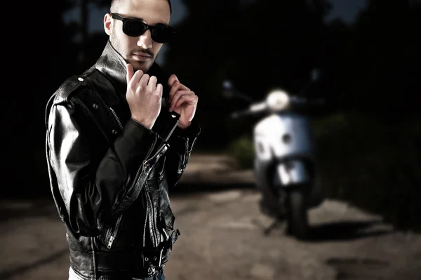 Biker on leather jacket and sunglasses