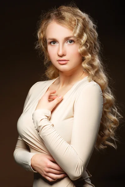 Lovely model with shiny volume curly hair