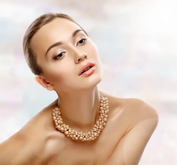 Beauty Portrait. Girl with necklace. Perfect Fresh Skin. Isolate
