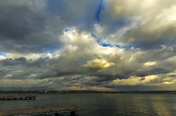 Very dramatic surround the sky with bright spots of the setting sun