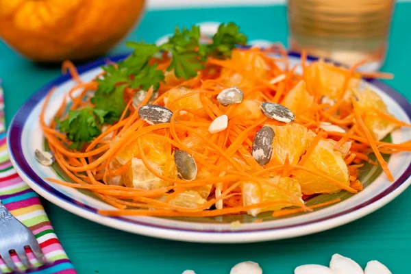 Carrot and orange salad with pumpkin seeds