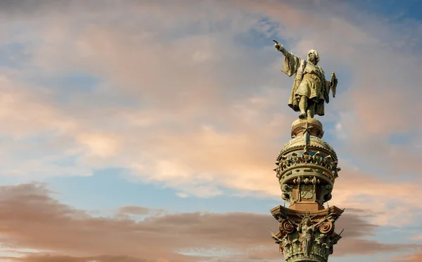 Monument of Christopher Columbus pointing towards America during golden sunset in Barcelona, Catalonia, Spain