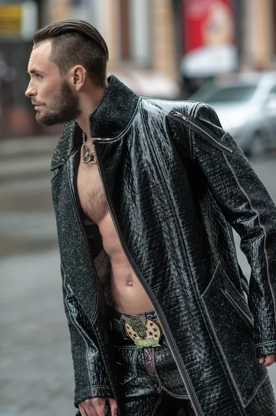 Stylish man on the street in a leather coat.