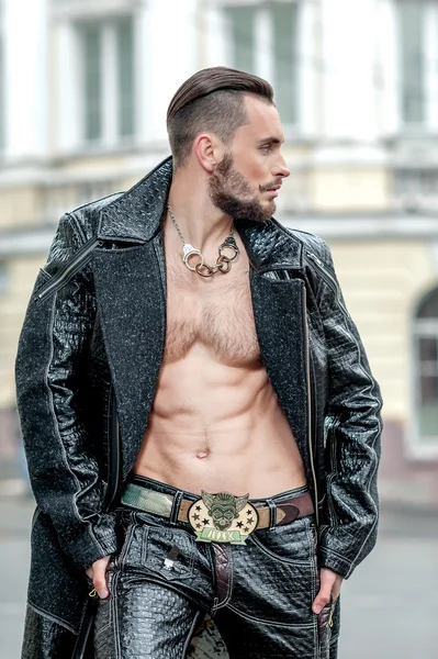 Stylish man on the street in a leather coat.