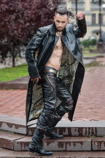 Stylish man on the street in a leather coat.
